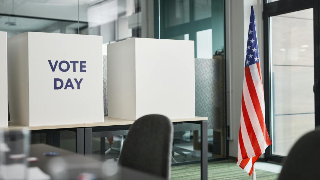american flag and voting boxes
